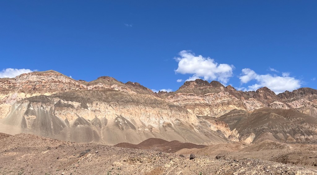 rocky hill with brown layers