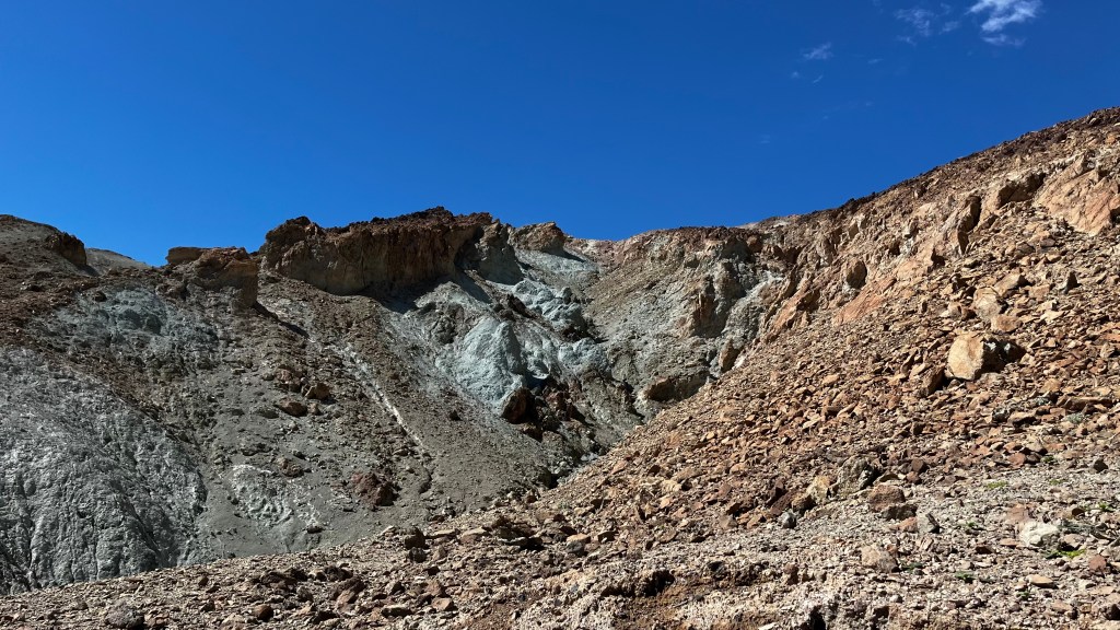 rocky hill with greenish tint on parts